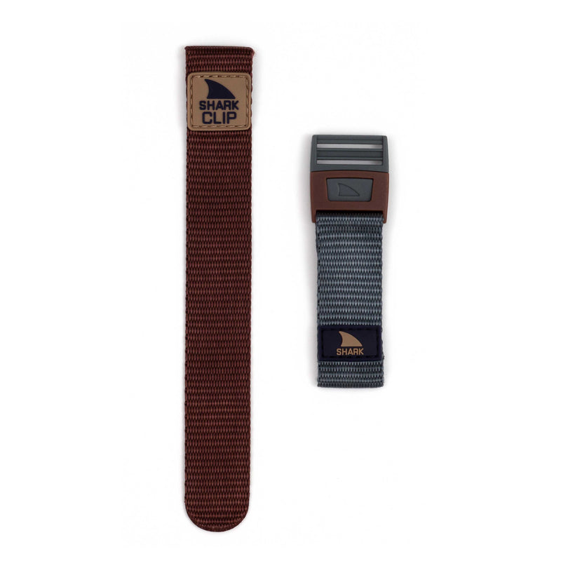 A Freestyle STRAP KIT - CLIP - MOJAVE and a gray patterned band, each featuring a clip closure, displayed on a white background.