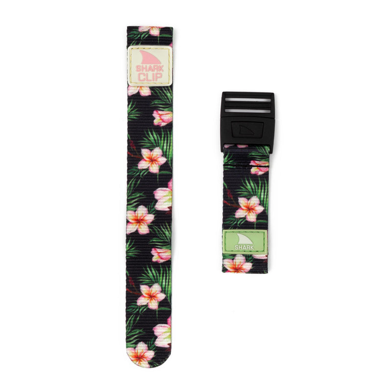 Two Freestyle Plumeria watch bands: one featuring a black buckle, the other sporting a Shark Clip Strap closure.