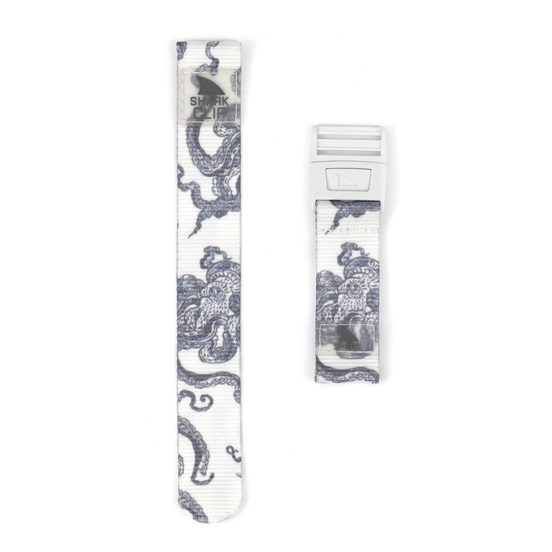 Two white Freestyle Shark Clip straps with blue octopus designs, one longer; both are from the STRAP KIT - CLIP.