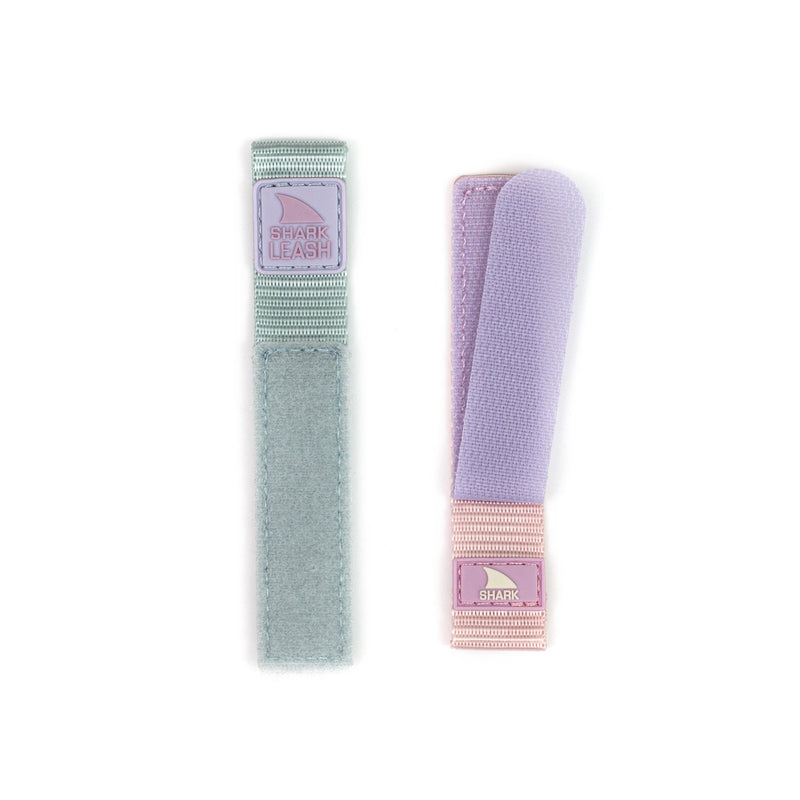 Two Freestyle STRAP KIT - LEASH - WILDWOOD straps with secure closures, displayed side by side in light blue and purple.