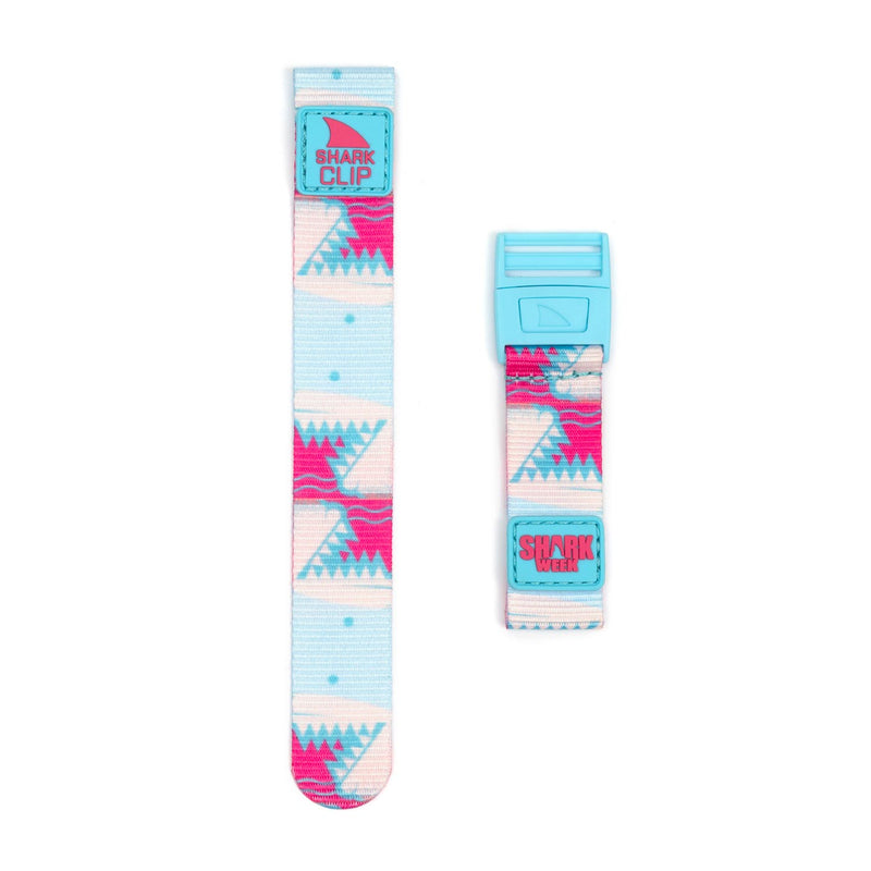 Two colorful Freestyle STRAP KIT - CLIP - SW PINK TEETH straps featuring geometric patterns and blue clip closures.