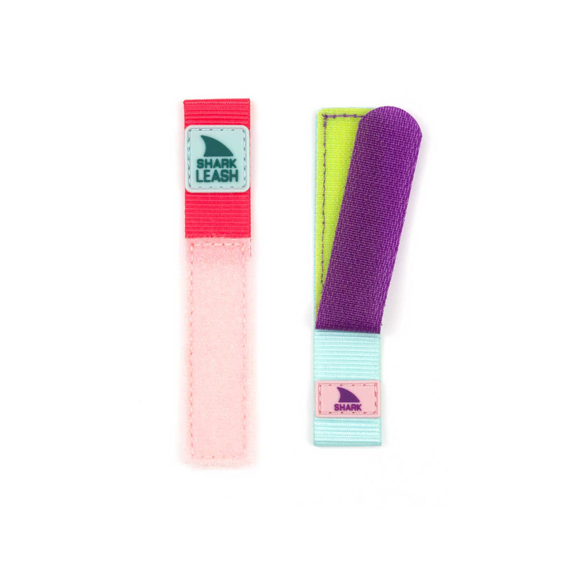 Two vibrant Freestyle STRAP KIT - LEASH - GUAVA LAVA wristbands with leash closure, displayed on a white background.
