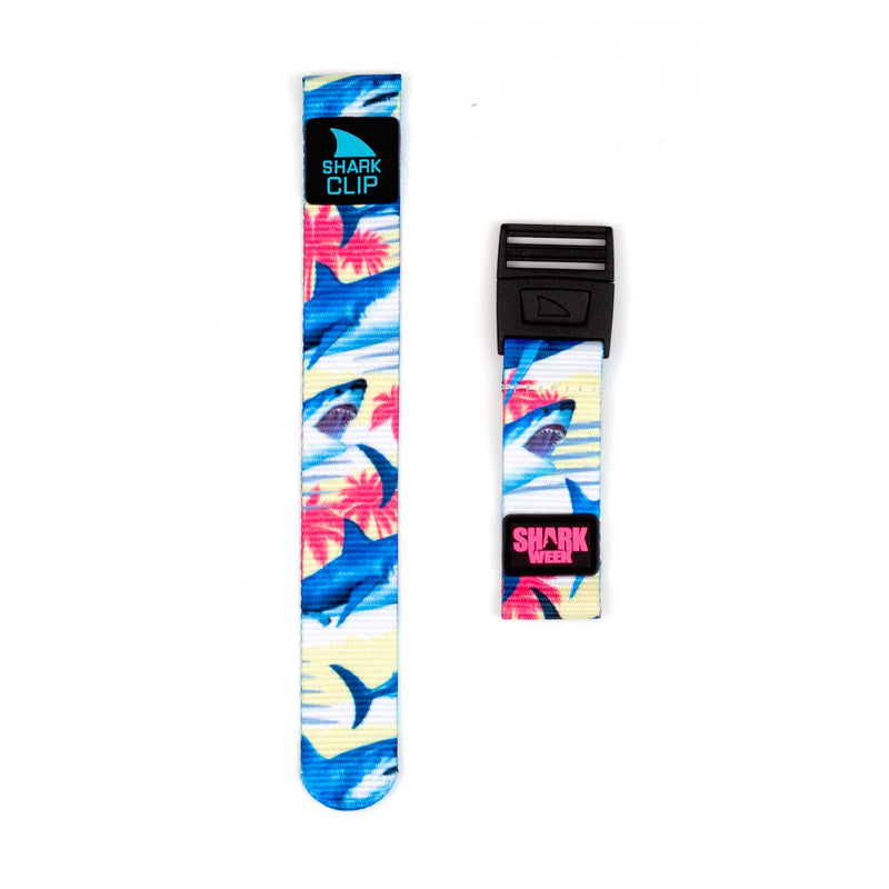 Two vibrant Freestyle clip straps, SW Miami Bites Yellow and Shark Week, featuring shark and floral patterns.
