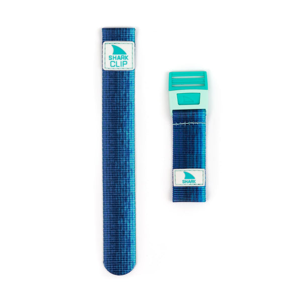 Image of two Wavelength Azul Freestyle Shark Clip straps in blue and teal, featuring both clip and loop styles, set on a white background.
