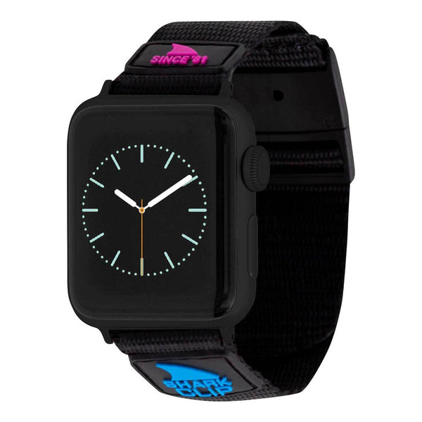 The APPLE WATCH™ CLIP STRAP PRIMARY BLACK by Freestyle features a fabric strap decorated with vibrant Shark branding.