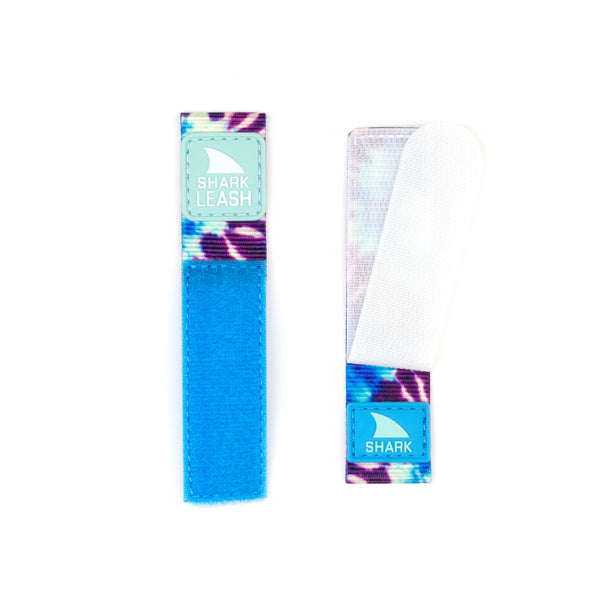 A blue and purple Freestyle APPLE WATCH™ LEASH STRAP BLUE DAZE featuring a white band.