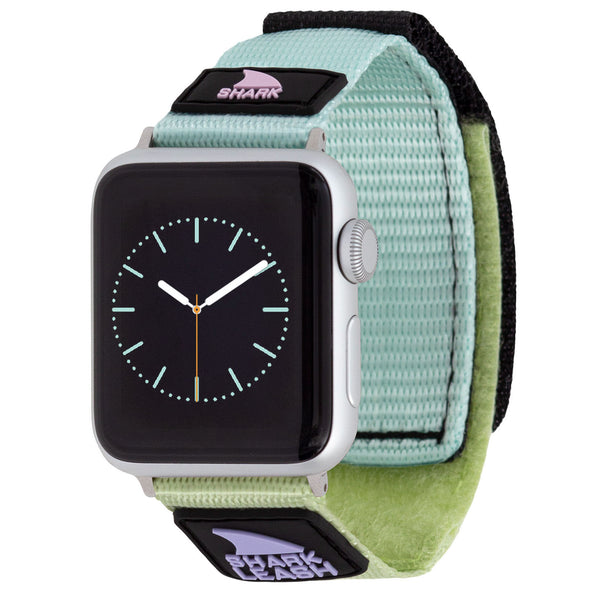 APPLE WATCH™ with a green tea Freestyle strap, featuring a black dial and minimalist analog display from Neven Eyewear.