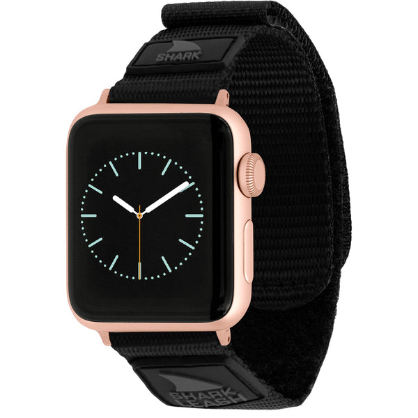 A smartwatch with a gold case, black screen, and Freestyle APPLE WATCH™ LEASH STRAP DARK MODE, displaying a blank interface.