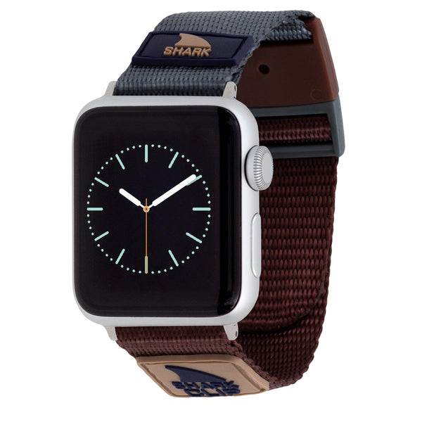 APPLE WATCH™ with a dark face and Freestyles textured MOJAVE Shark Clip strap featuring a Shark logo.