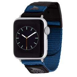 The Freestyle APPLE WATCH™ CLIP STRAP ROYAL BLUE/BLACK shows an analog clock on a black screen with a silver frame.