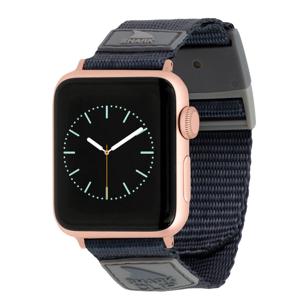 Freestyles Apple Watch Clip Strap Granite: gold case, black dial, glow-in-the-dark hands on a dark gray Shark Clip Strap.