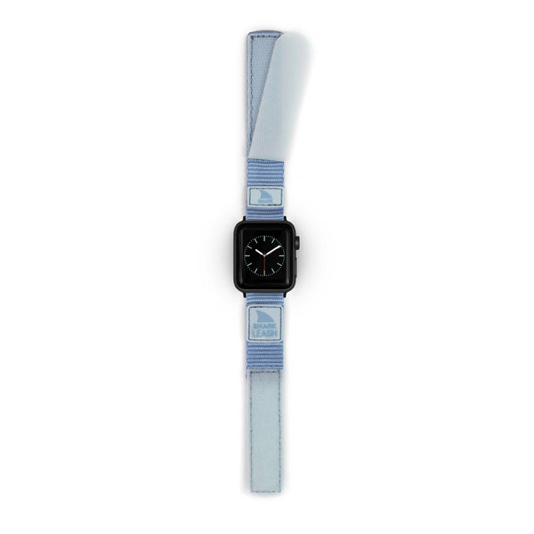 Freestyle APPLE WATCH™ LEASH STRAP SKY: Black watch face, light blue fabric band featuring MLB logos, secure closure system.