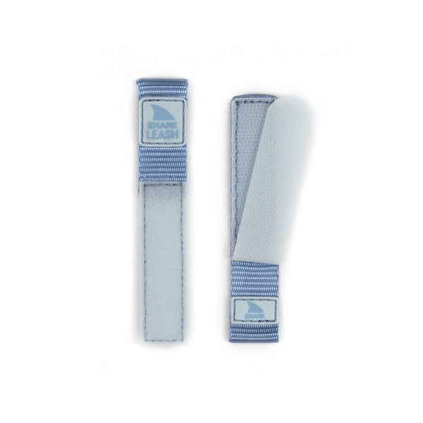 Two fabric straps featuring Velcro closures, Share Leash logos, and a hint of Freestyles APPLE WATCH™ LEASH STRAP SKY design displayed on a white background.