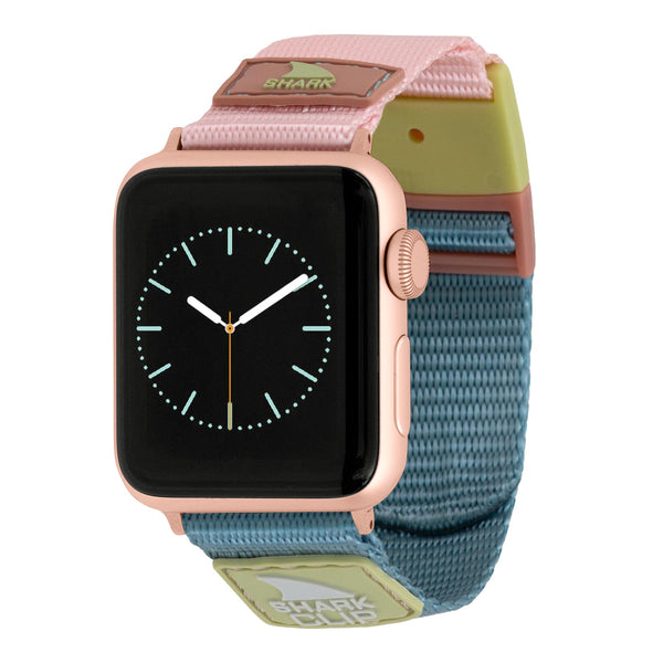 APPLE WATCH™ CLIP STRAP CABO by Freestyle with a nylon strap featuring pink, blue, and green colors, a clip closure, and an analog clock face.
