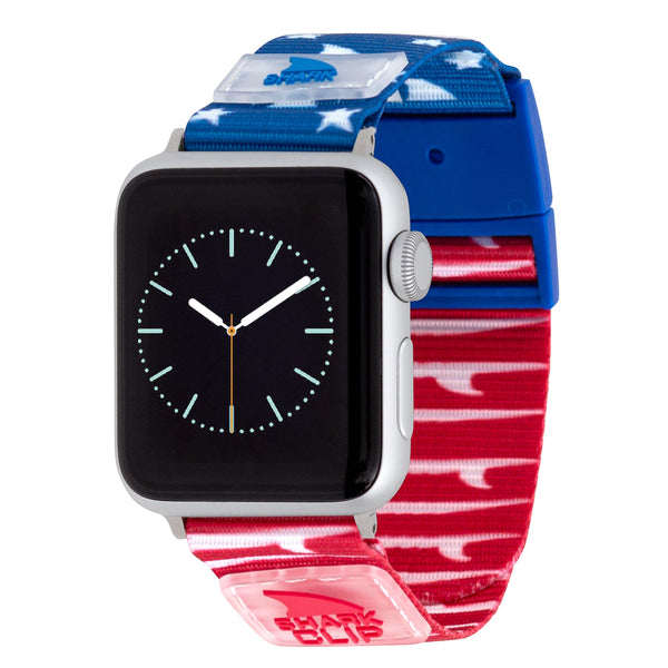 APPLE WATCH™ CLIP STRAP FINS & TAILS by Freestyle, red/white/blue band, black face, white watch hands.