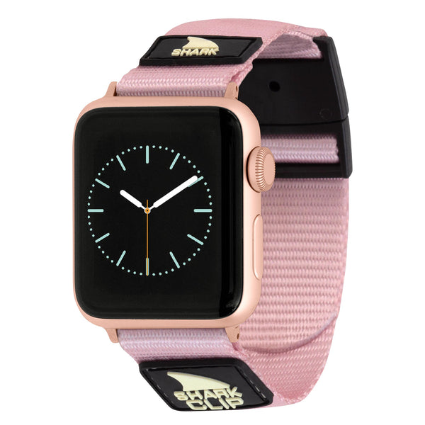 APPLE WATCH™ featuring a Freestyle Mochi Pink strap, black face, and light blue accents on the hands and markers.