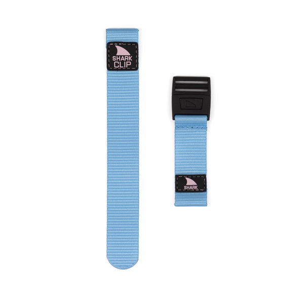 Image showing two strap kits, the STRAP KIT - CLIP - ACAI BERRY by Freestyle. The straps are light blue with black clips, featuring one long strap and one short strap, set against a white backdrop.
