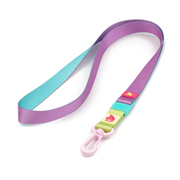 Freestyle Lanyard from Freestyle: Purple and blue strap with a pink shark clip and detachable multicolored tags.