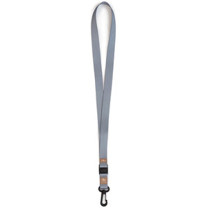 The Freestyle Sahara Lanyard & Key Chain features gray fabric, a black plastic clip, and a metal hook.
