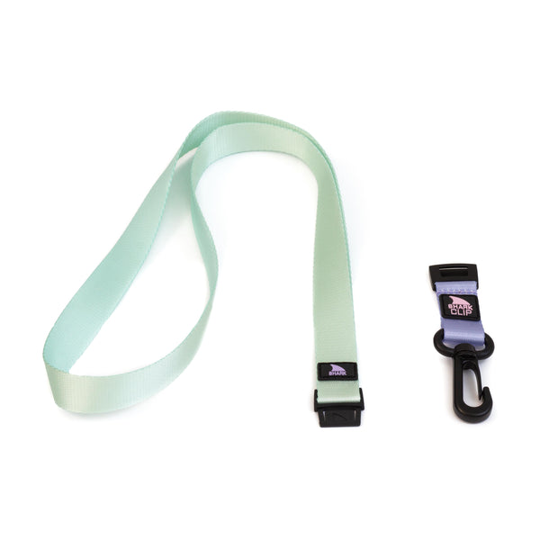 Freestyle Green Tea Lanyard and black/purple badge clip lying adjacent to each other.