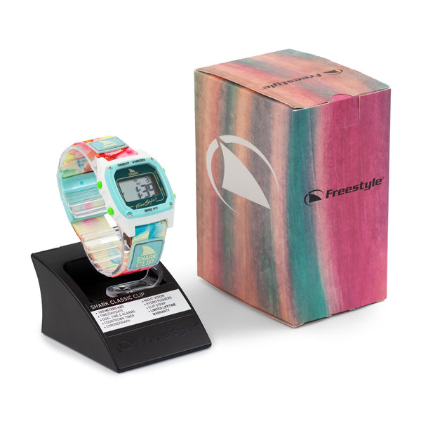 Freestyles SAGE ERICKSON SIGNATURE SHARK CLASSIC CLIP FLOWER POWER watch featuring a striped pattern adorned with tropical floral designs.
