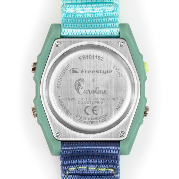 Back view of the Freestyle Caroline Marks Signature Shark Classic Leash Melbourne featuring blue and green straps designed for surfing.
