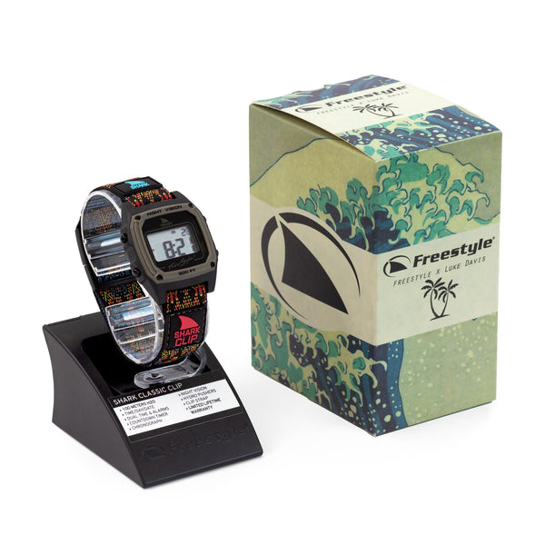 Freestyles LUKE DAVIS SIGNATURE SHARK CLASSIC CLIP MOROCCO watch displayed beside a box with Moroccan coastline wave art.