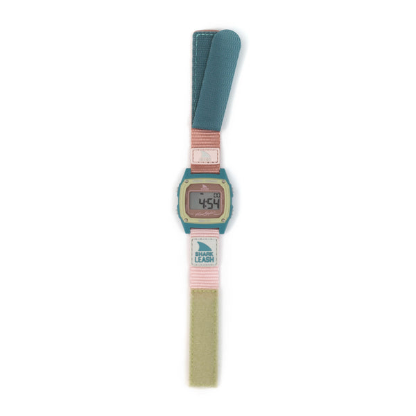Freestyles SHARK CLASSIC LEASH CABO watch with a teal and pink strap showing 4:54, set against a white background.
