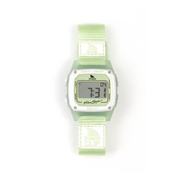A mint green Freestyle SHARK CLASSIC CLIP LIME with a fabric strap displays numerals on its digital surf watch screen.