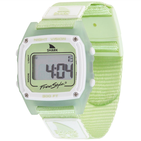A Freestyle SHARK CLASSIC CLIP LIME digital surf watch displays numbers and a calendar date on its screen.
