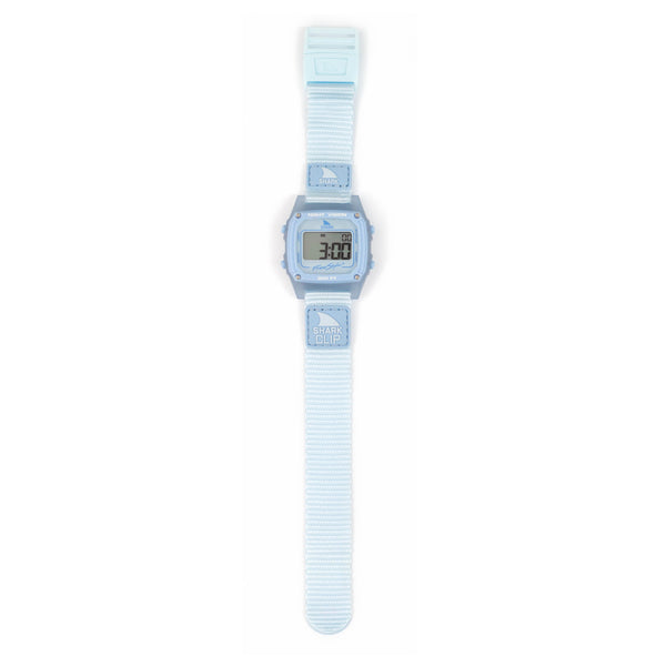 Freestyle SHARK CLASSIC CLIP SKY digital watch in light blue with textured strap, display shows numbers on screen.