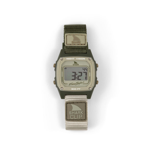 Freestyle SHARK CLASSIC CLIP ENSENADA digital surf watch with rectangular face, green case, gray strap showing 3:24.