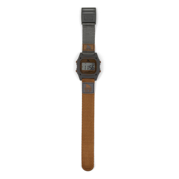 Freestyles SHARK CLASSIC CLIP MOJAVE watch displaying 11:56, with a brown strap and gray accents.