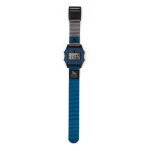 Freestyle SHARK CLASSIC CLIP MISSION BEACH: blue strap, rectangular face, surf-inspired, digital numbers visible on screen.