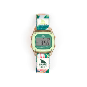 Freestyle SHARK CLASSIC CLIP PARADISE PEACH digital watch with green face and fabric band, display is active.