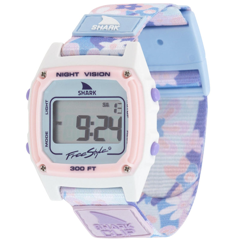 SHARK CLASSIC CLIP PERIWINKLE by Freestyle: digital surf watch with pastel floral strap, pink face. Display shows numbers.