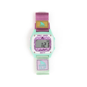 The Freestyle SHARK CLASSIC CLIP GINGHAM PINK features a mint case and vibrant strap, with a digital display on the face.