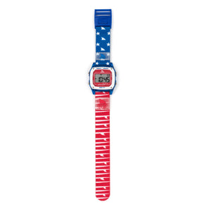 Freestyle SHARK CLASSIC CLIP FINS & TAILS digital watch with an American flag band, digital display shows numbers.