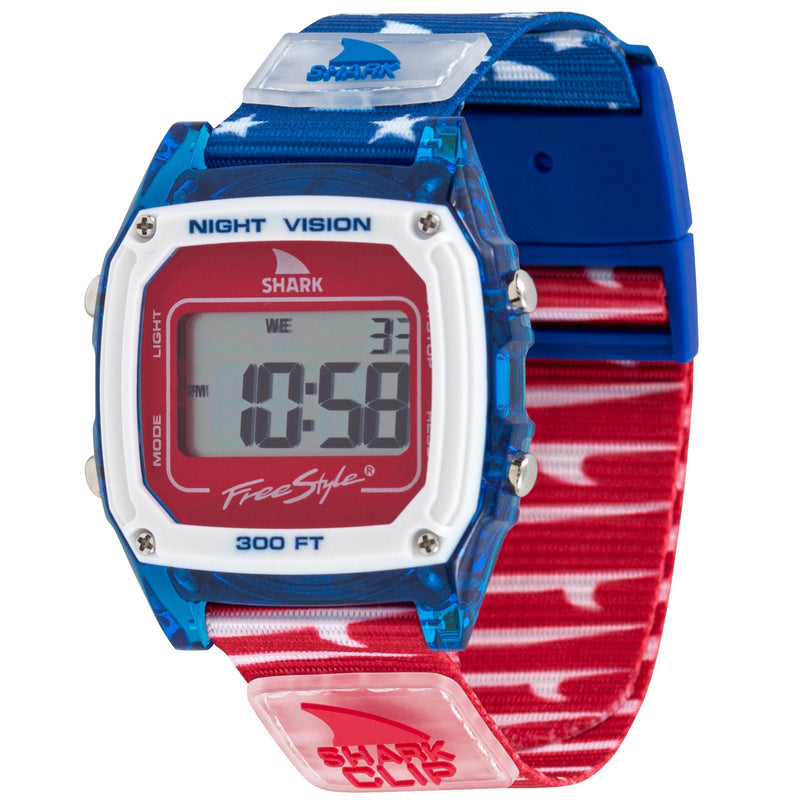 Freestyle SHARK CLASSIC CLIP FINS & TAILS digital watch with blue/red star band and rectangular face displaying numbers.