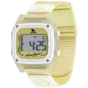 A yellow Freestyle SHARK CLASSIC CLIP SUNSHINE digital surf watch with square face displays numbers and text on its screen.