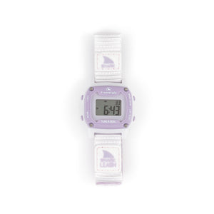 A Freestyle SHARK MINI LEASH LILAC SPLASH watch with a white strap displays numbers on its face.