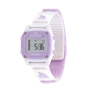 Freestyle SHARK MINI LEASH LILAC SPLASH watch with lavender face and white strap, displaying numerals on its digital screen.