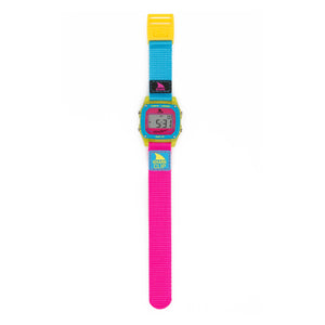 Freestyle SHARK CLASSIC CLIP LANTERN SHARK watch with teal/pink strap, yellow case, blue label, digital display visible.