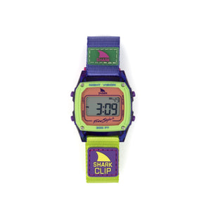 Digital watch with a purple strap and green display on a white background