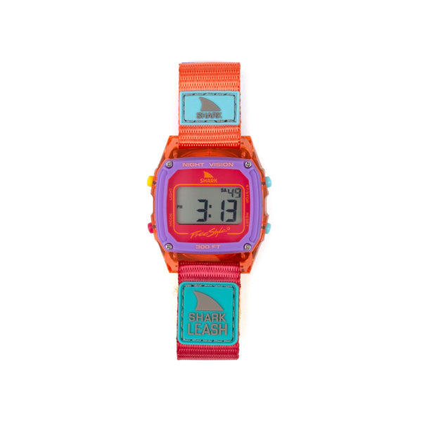 Colorful digital watch with a shark-themed strap on a white background