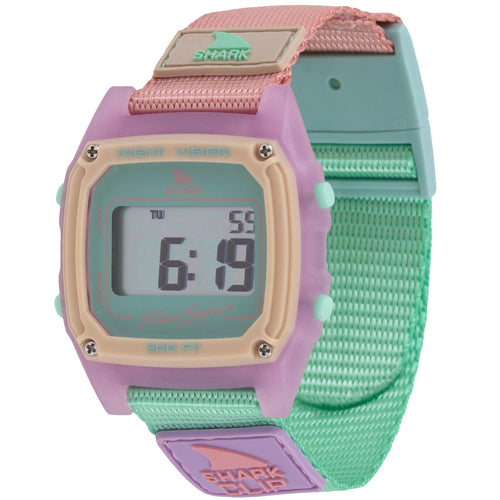 The Freestyle SHARK CLASSIC CLIP MELON MIX is a pastel digital watch with a square face and a pink, green, and beige strap.