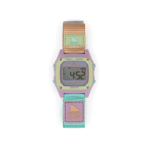 A Freestyle SHARK CLASSIC LEASH MINT POP watch with a fabric strap displayed on its digital screen.