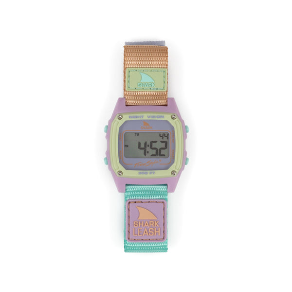A Freestyle SHARK CLASSIC LEASH MINT POP watch with a fabric strap displayed on its digital screen.