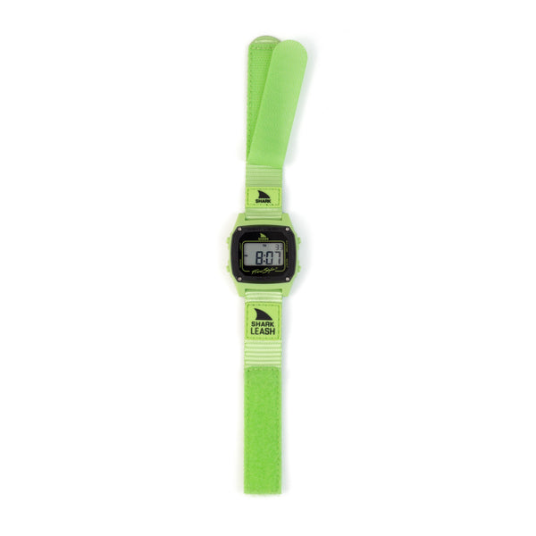 Digital watch with a green strap on a white background