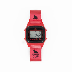 Red digital watch with shark design on a white background